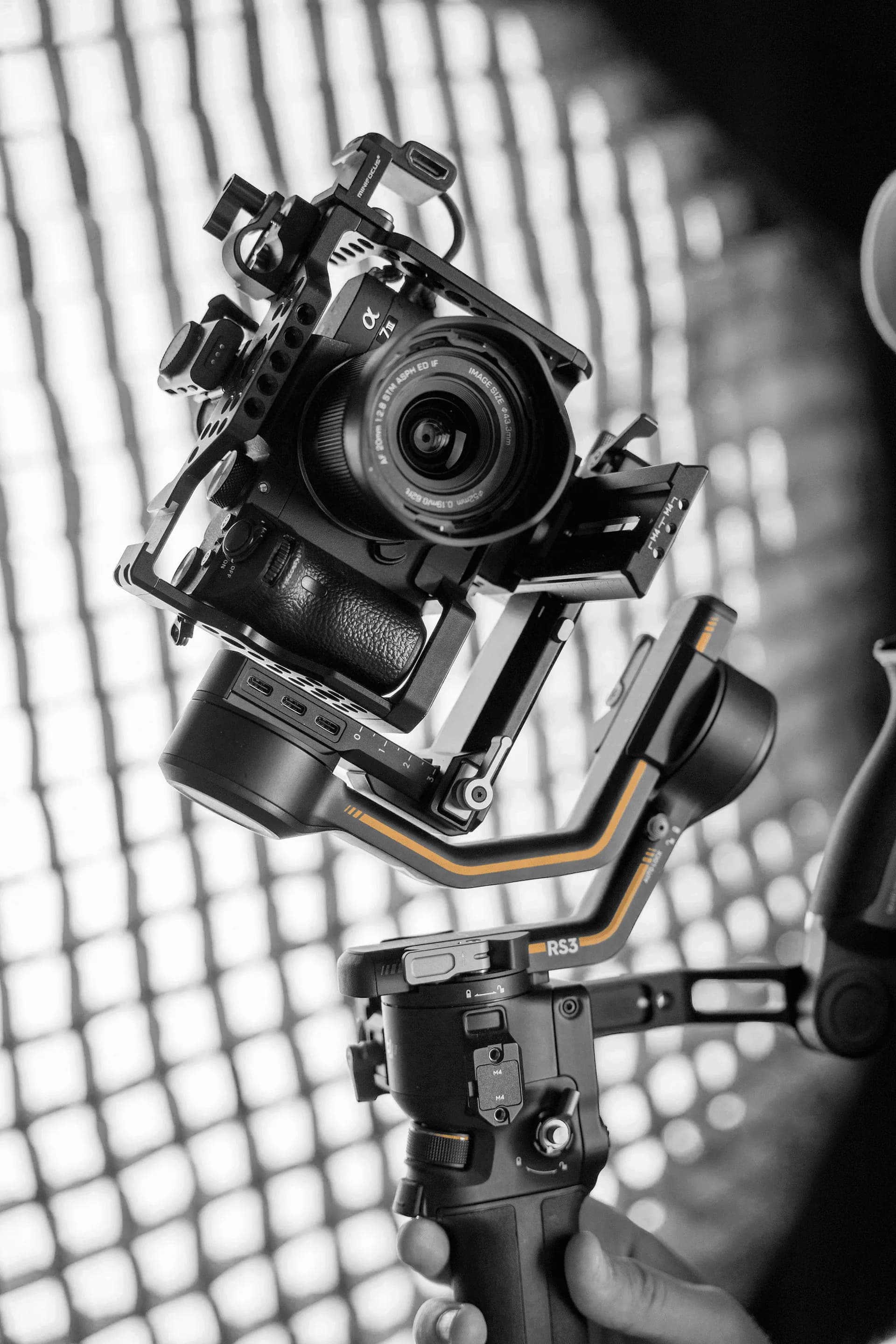 A mirrorless camera rigged to a gimbal